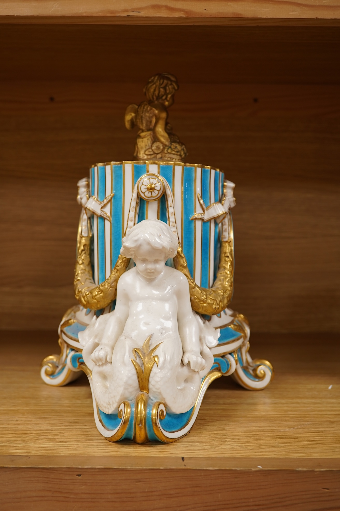 A 19th-century Sevres style porcelain mantel clock, 29cm tall